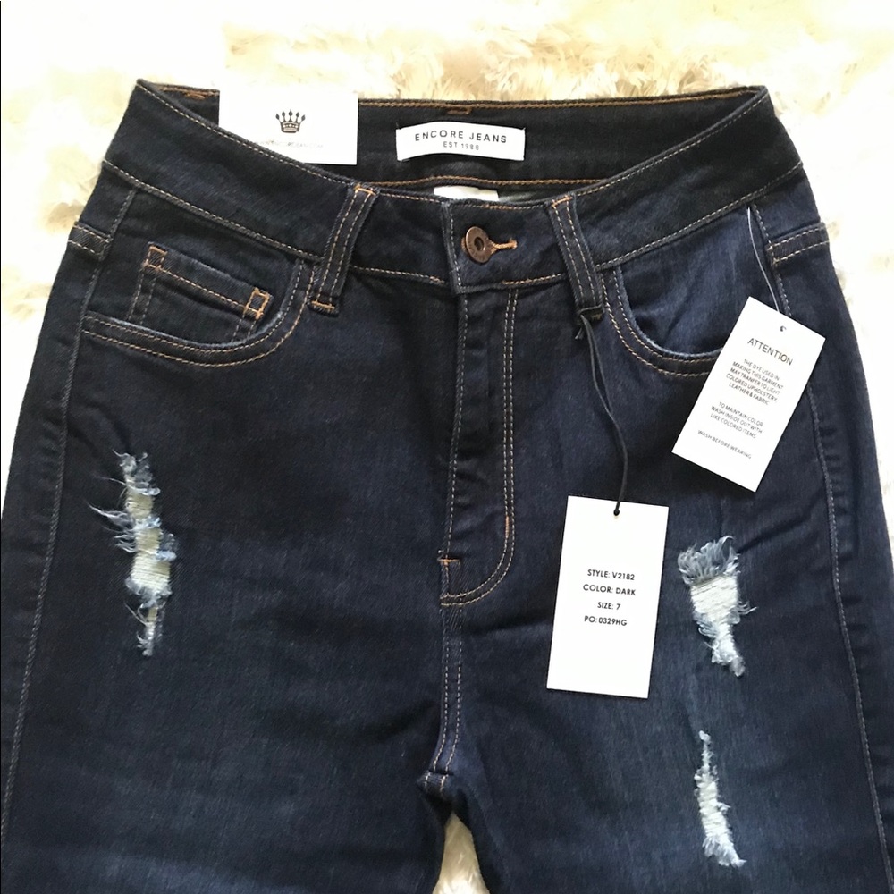 High rise ripped dark blue jeans